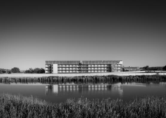 a building next to a body of water