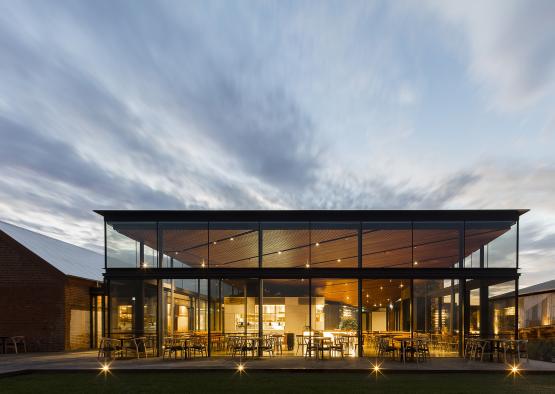 a building with glass walls and a large glass wall