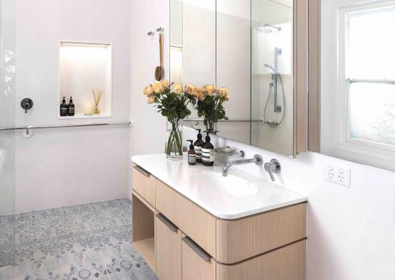 a bathroom with a sink and flowers