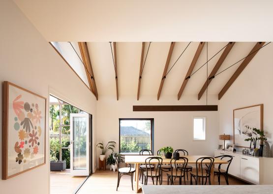 a dining room with a table and chairs