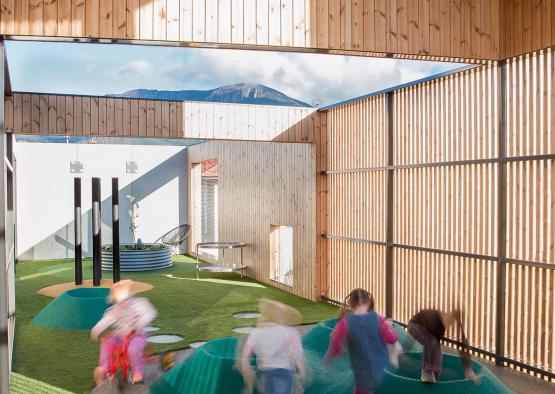 a group of children playing in a playground