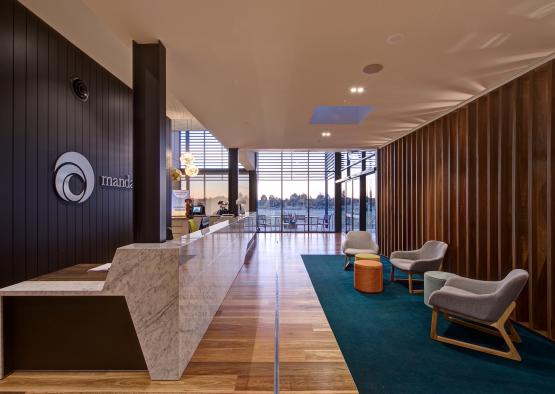 a lobby with a marble counter and chairs