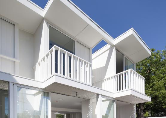 a white house with a balcony