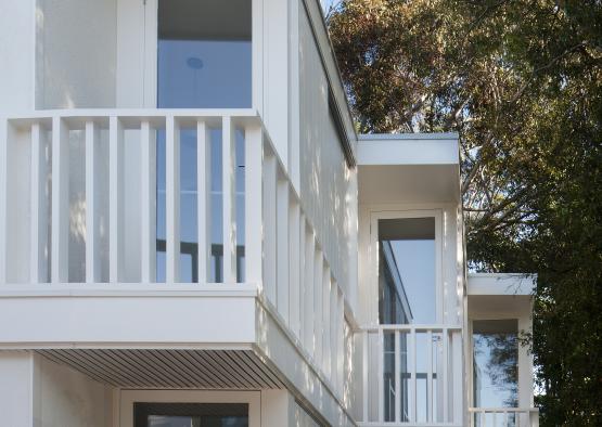 a white building with a balcony