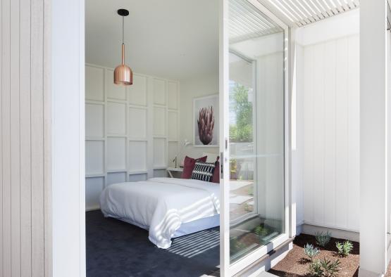 a bedroom with glass doors