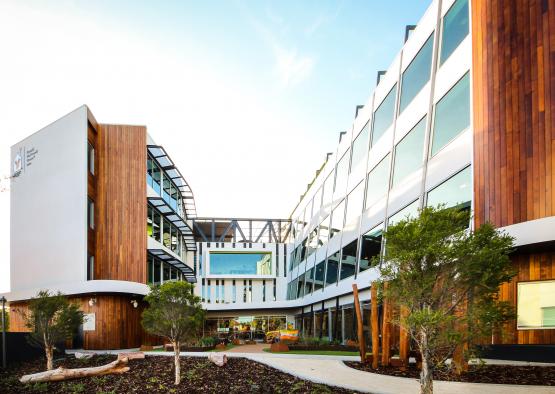 a building with trees and a courtyard