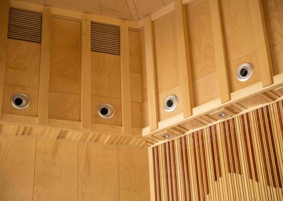 a wood paneled ceiling with holes in the ceiling