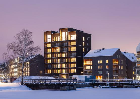 a building next to a body of water