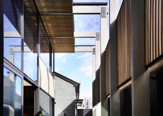 a courtyard with a table and chairs