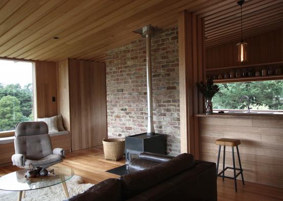 a living room with a fireplace and a wood floor