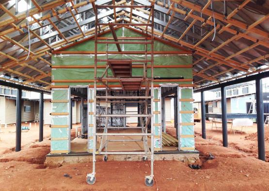 a building under construction with a ladder