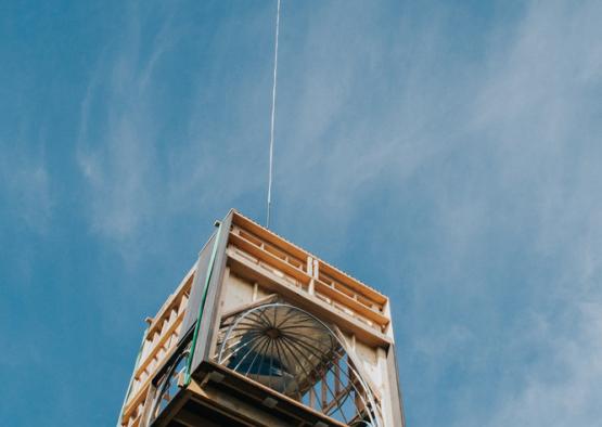 a helicopter flying over a box