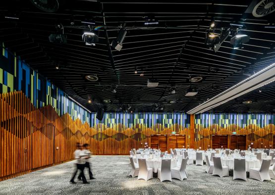 a room with white tables and chairs