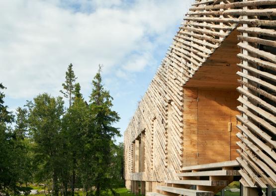 a wooden building with stairs outside