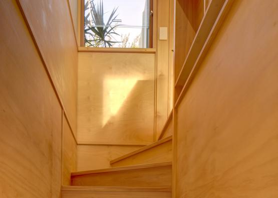 a wooden staircase with a window