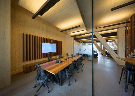 a conference room with a table and chairs