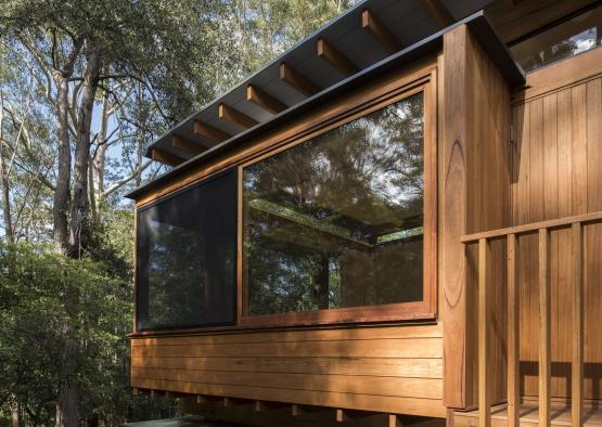 a wooden house with a porch and a porch