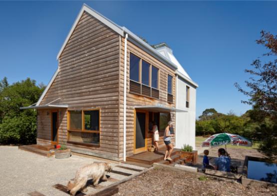 a house with a couple of people and a dog