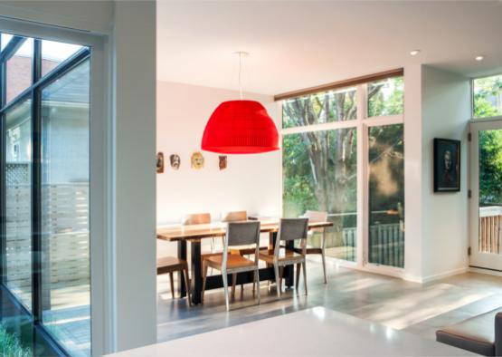 a dining room with a table and chairs