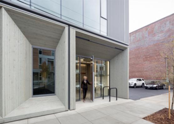 a woman walking into a building