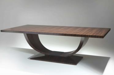 a brown table with a curved base