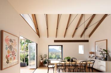 a dining room with a table and chairs