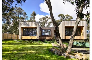 a house with trees and grass