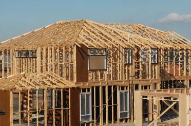 a house under construction with a roof