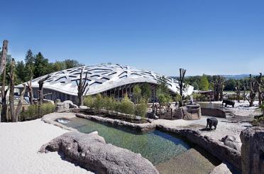 a building with a dome roof and water pools