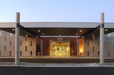 a hospital entrance with a covered entrance