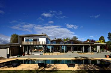 a house with a pool in the back