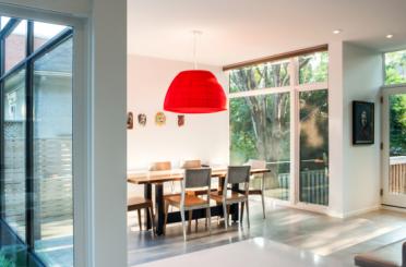 a dining room with a table and chairs